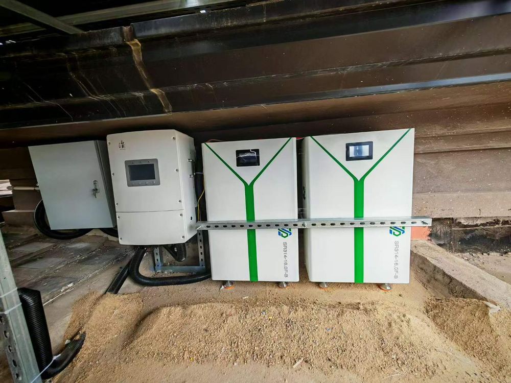 Two SR314-16.0F-B battery packs and a hybrid inverter installed under a roof overhang at a customer site
